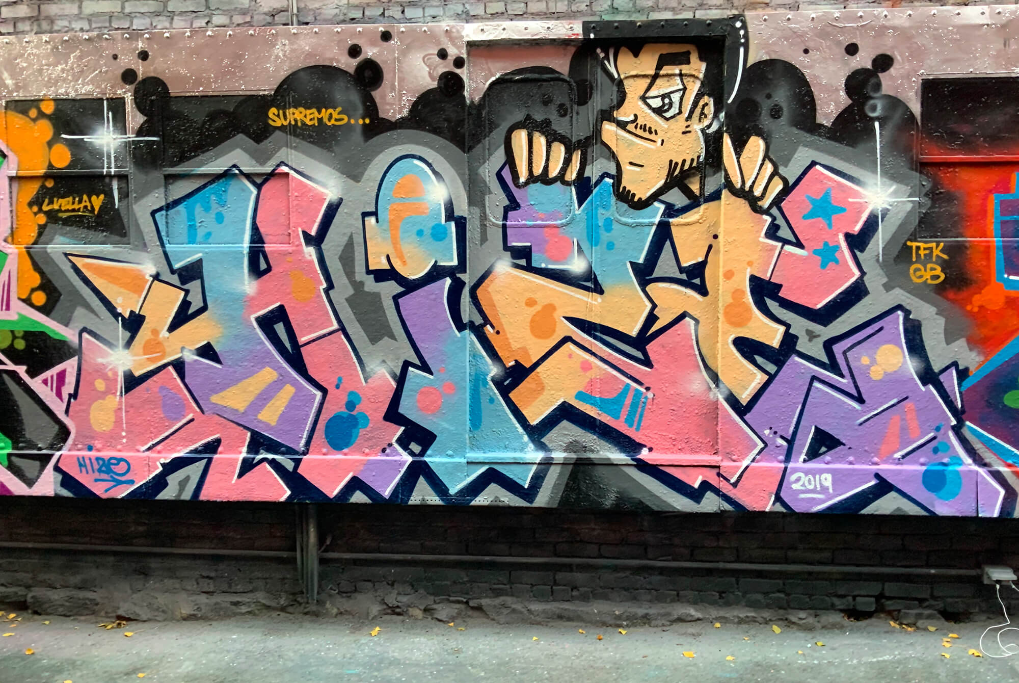 Hize Bronx graffiti piece with pastel wildstyle letters and cartoon character