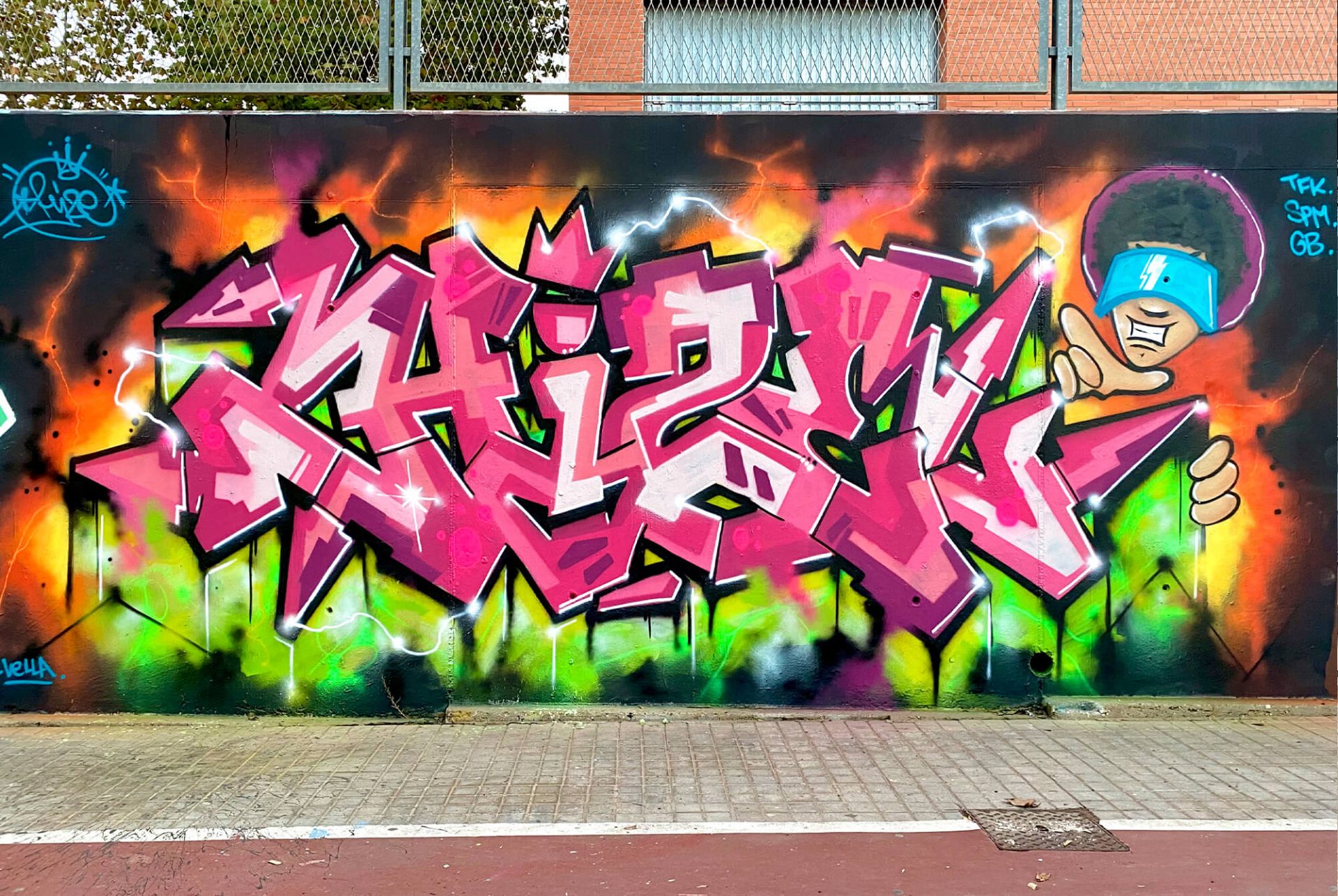 Hize Mislata graffiti mural with pink lettering and electric background