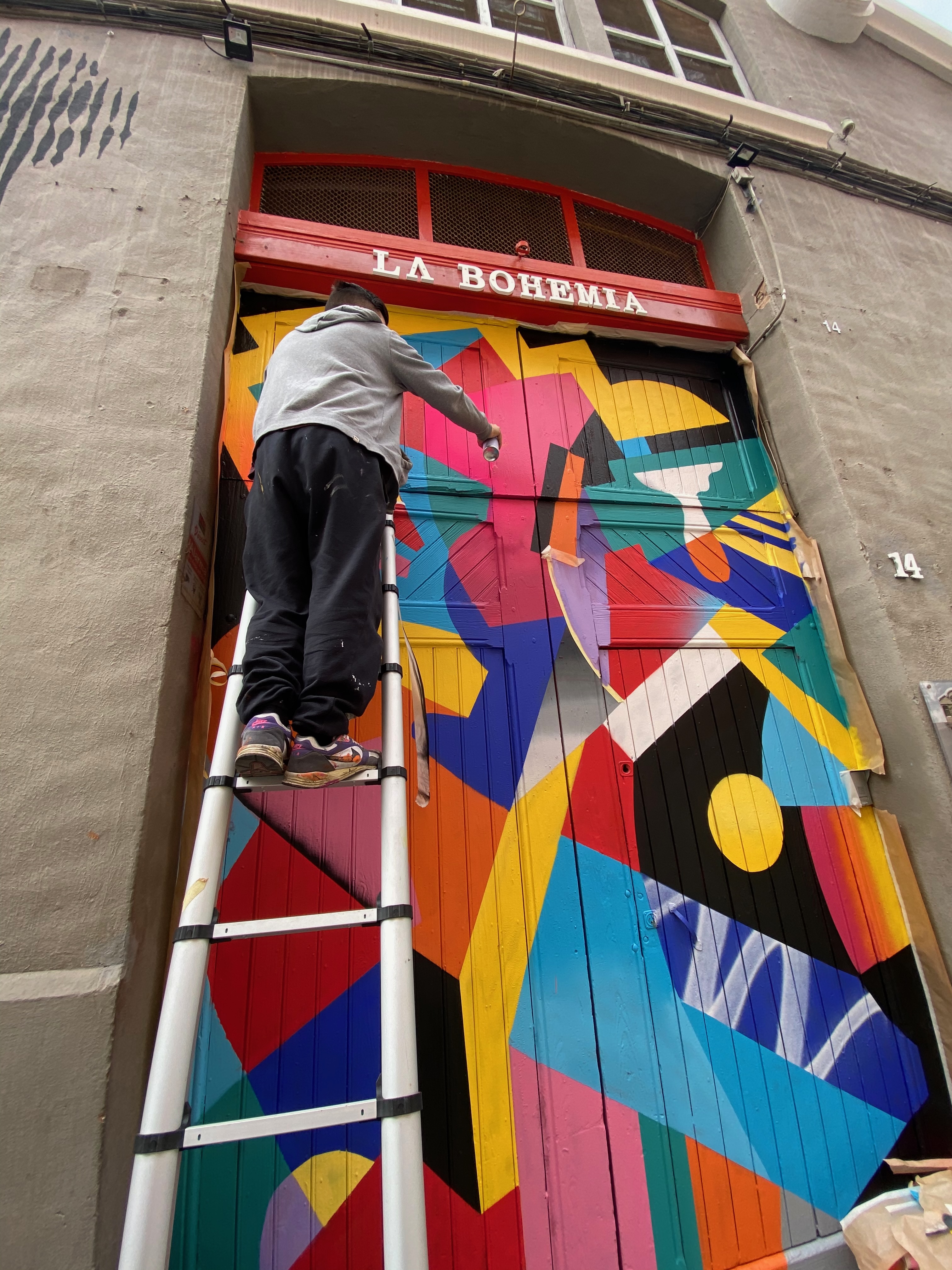 Hize abstract mural with colorful graffiti shapes in an interior space