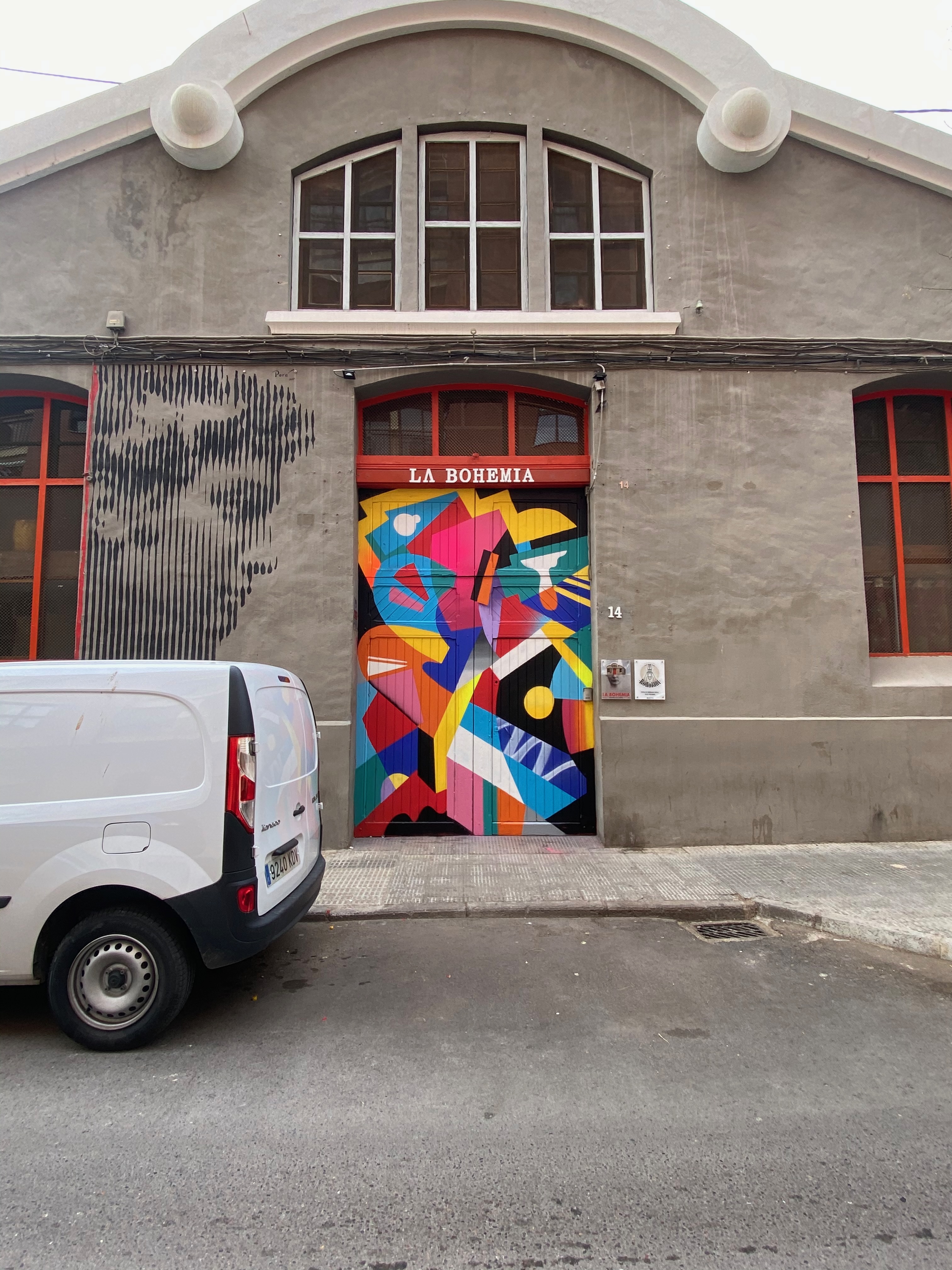 Hize abstract mural with colorful graffiti shapes in an interior space